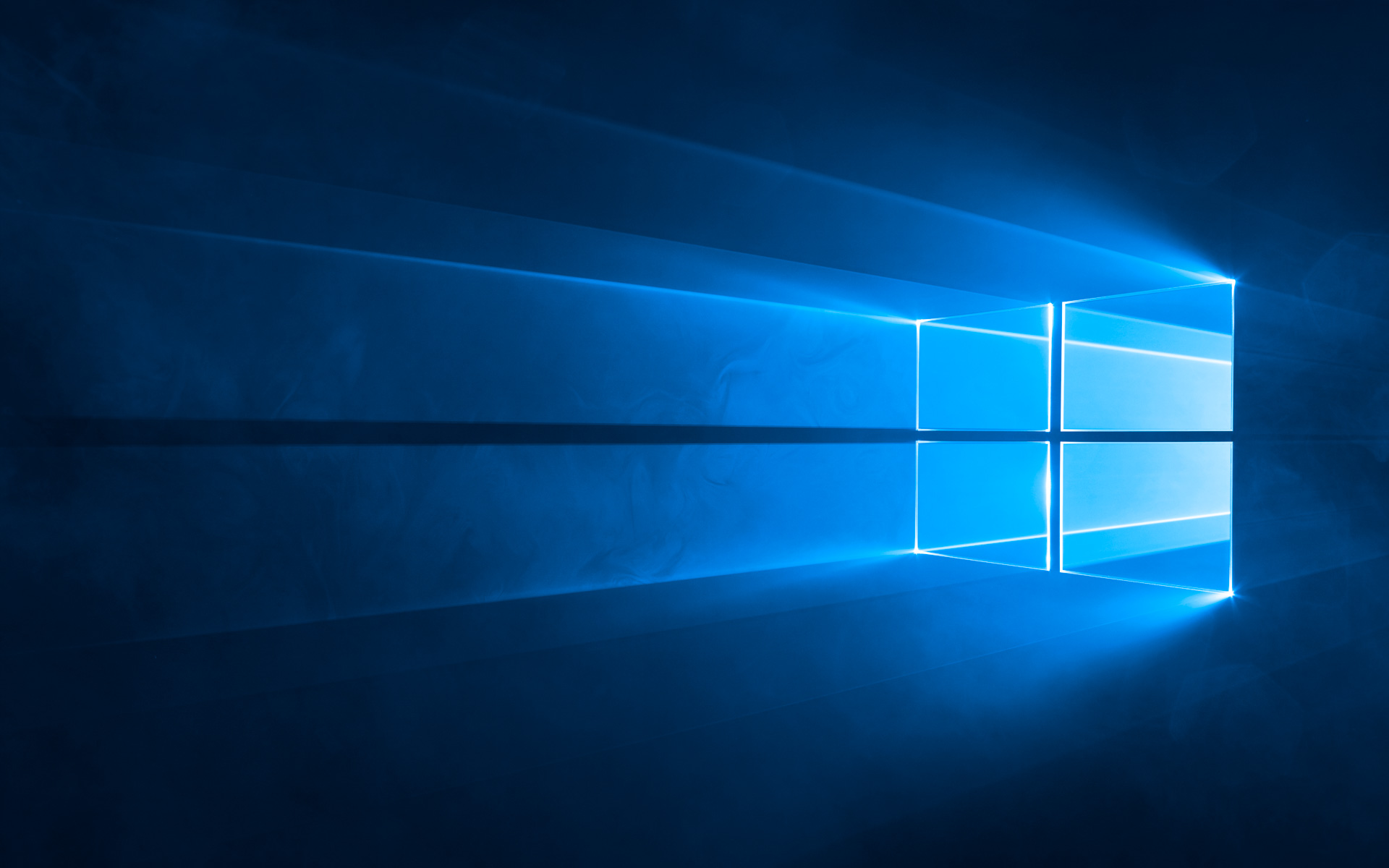 Windows 10's default wallpaper, depicting a Windows logo shining through with what appears to be lasers coming out of the logo.